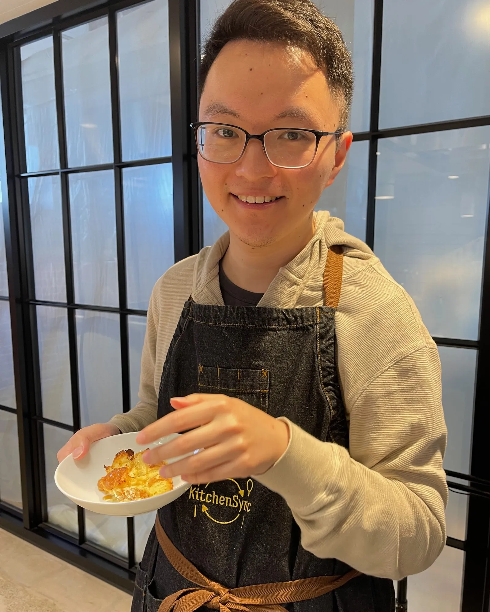 David plating a dish at a cooking class